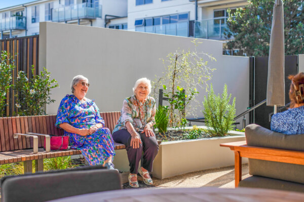 two elderly ladies at the park in their independent living space